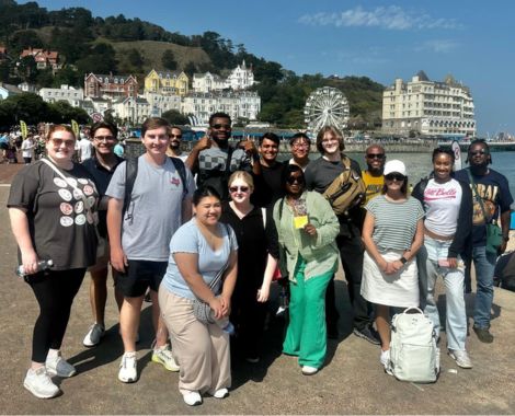Group of students visiting a beach in Wales.